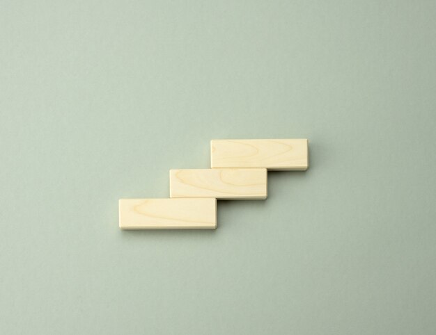 Three wooden cubes in the form of steps up