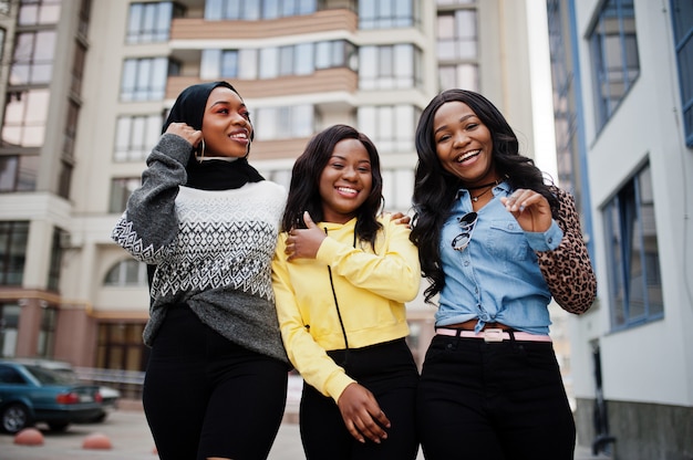 Three young college african american woman friends spend time together.