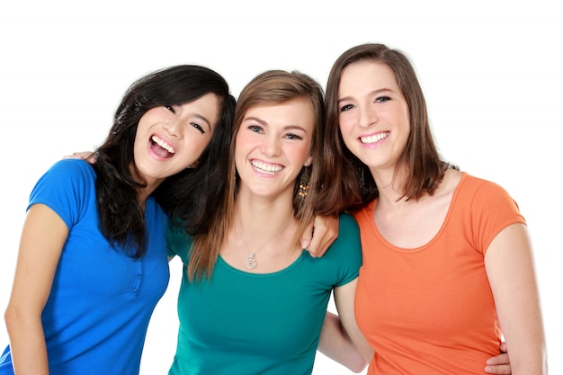 Three young women hugging