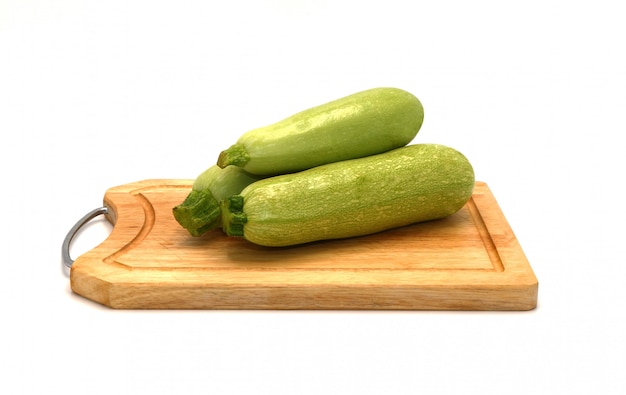 Three zucchini on a light background. Close-up.