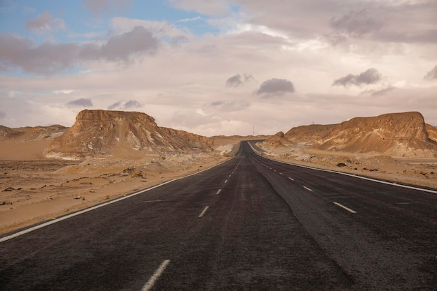 Threelane road with beautiful sky in the desert of Egypt