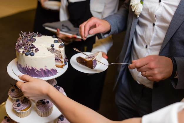 Threetiered wedding cake with strawberries on table