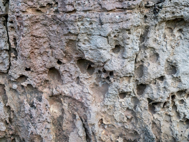 Through erosion from wind and rain for several years