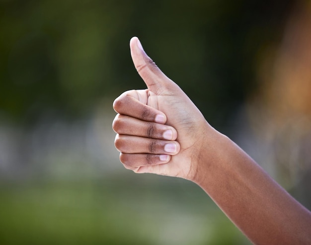 Photo thumbs up hand and gesture with person outside growth and yes or good news for support or eco friendly approval thank you emoji and agreement for company mission goal and ok sign for effort