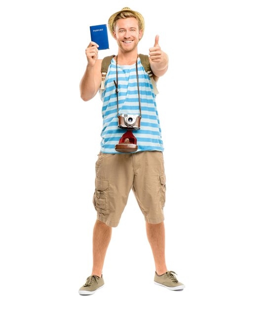 Photo thumbs up portrait and happy man with passport with white background for destination camera or tourist in studio travel backpack and person with gesture for agreement adventure or trip in cuba