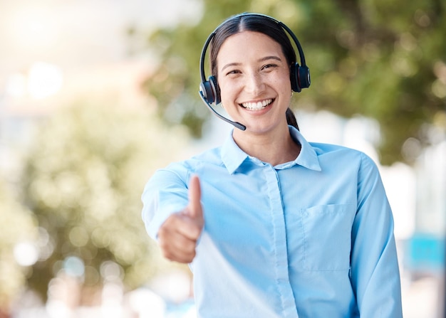 Thumbs up for success call center support and woman working at crm telemarketing company in city employee agreement and consultant thank you Portrait of happy and smile customer service worker