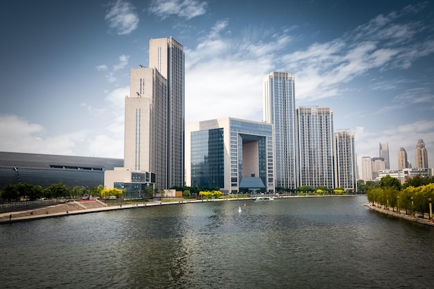 Tianjin cityscape of beautiful haihe river and modern buildings against a sunny sky