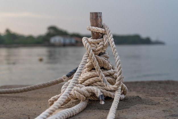 Tied up rope on a dock with early morning light