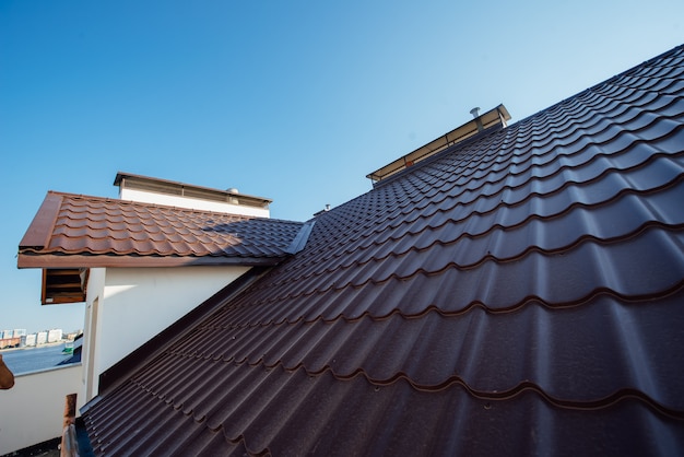 Tile Roof of a two-story white cottage