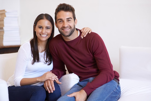 Time together is time well spent A husband and wife being affectionate while sitting together on the sofa