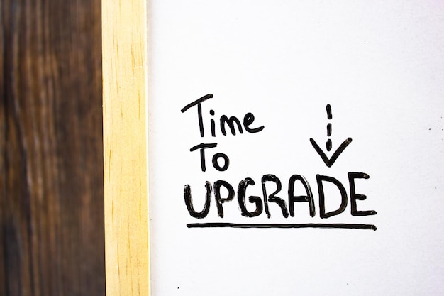 TIME TO UPGRADE text concept by marker on blackboard Software upgrade concept text