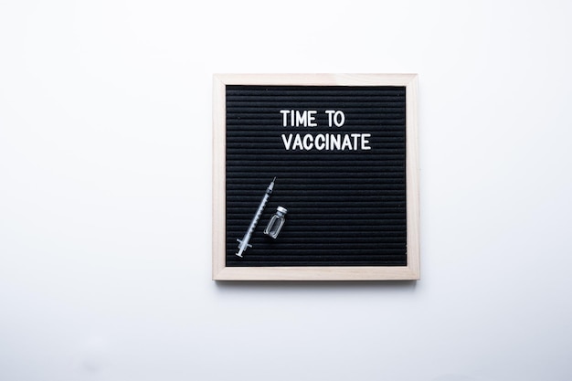 Time to vaccinate inscription on white background. Vaccination concept.