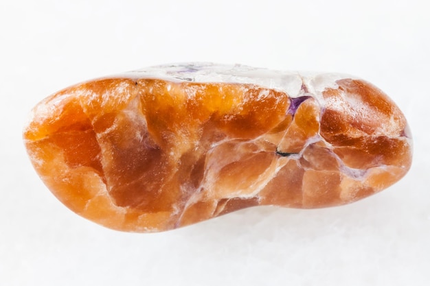 Tinaksite gemstone on white