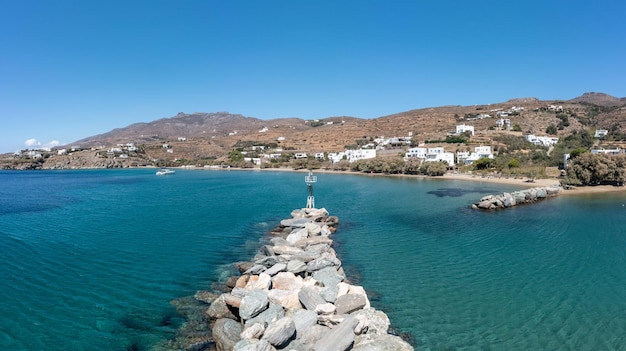 Tinos island Cyclades Greece Aerial drone panoramic view of Agios Romanos village blue sea