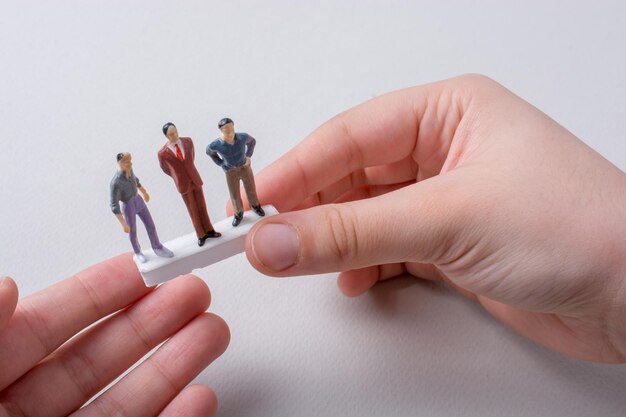 Tiny figurines of men model in view