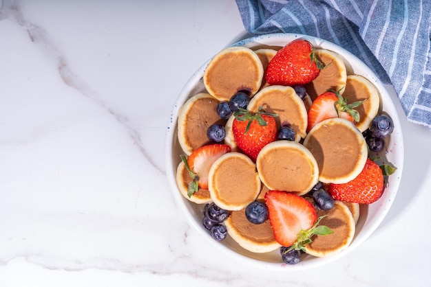 Tiny pancakes with strawberry