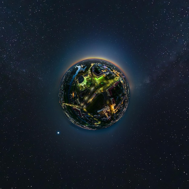 Tiny planet in night sky overlooking old town urban development historic buildings crossroads Transformation of spherical 360 panorama in abstract aerial view