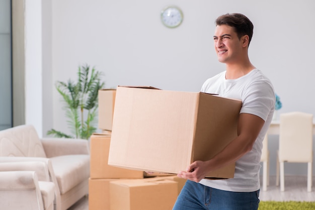 Tired delivery man with box