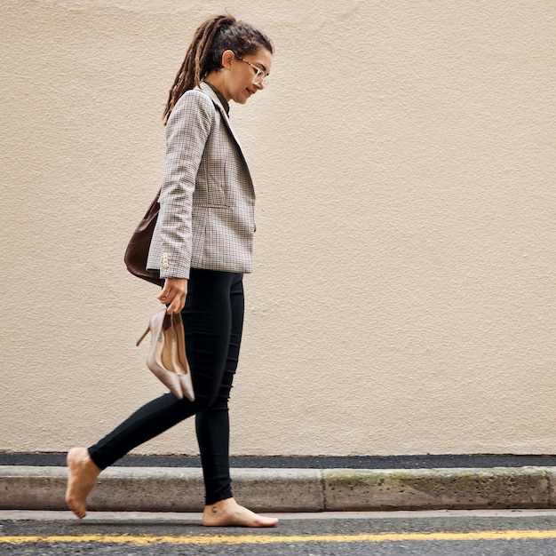 Photo tired depression and business woman in city for thinking fatigue and fear burnout mental health and mistake with female employee walking in street for sad failure and crisis with wall mockup