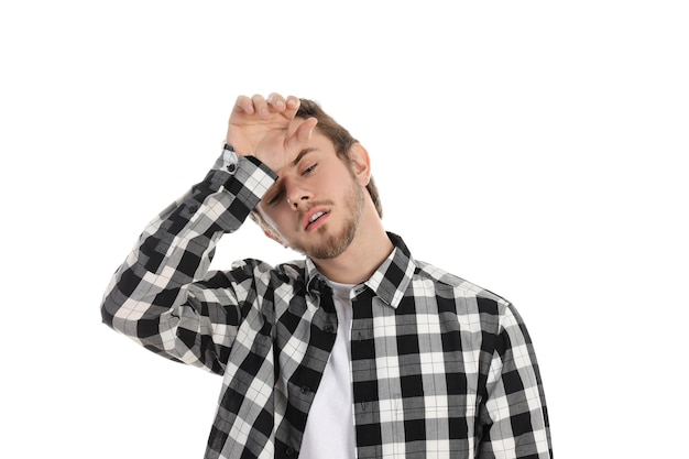 Tired young man isolated on white background