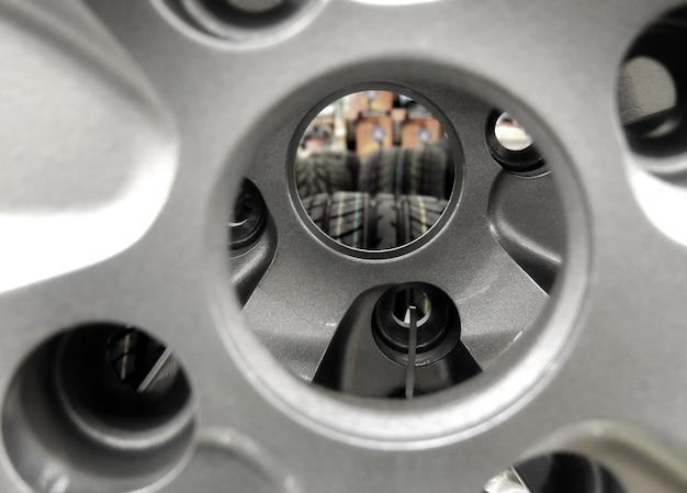 Tires View Through Central Hole Of Car Wheel Rim