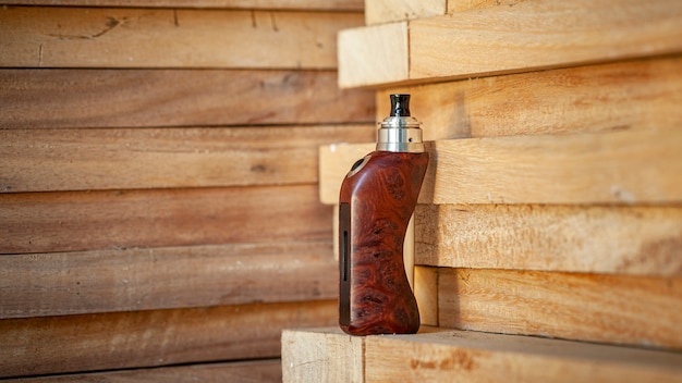 Titanium genesis atomizer on wooden background