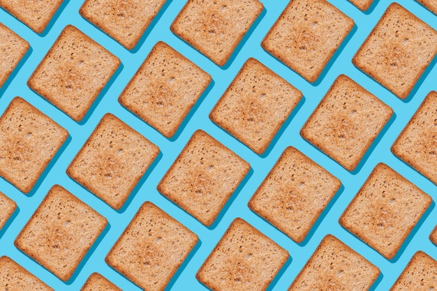 Toast pattern on blue background Creative food concept morning breakfast brunch concept