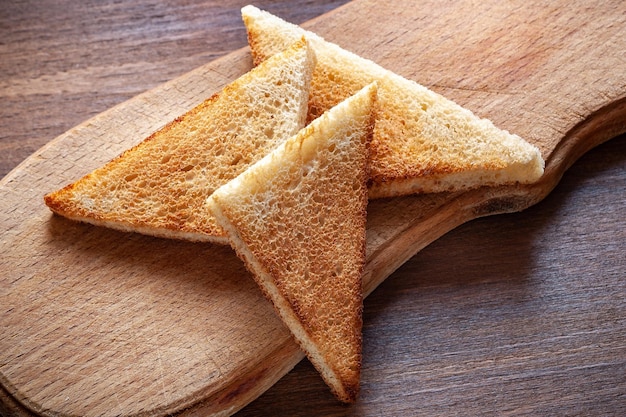 Toast slice bread on a wooden background