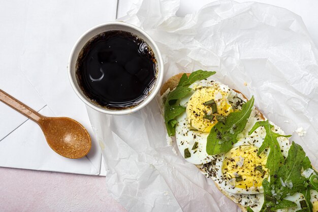 Toast with cream cheese arugula salad and boiled egg