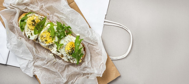 Toast with cream cheese arugula salad and boiled egg