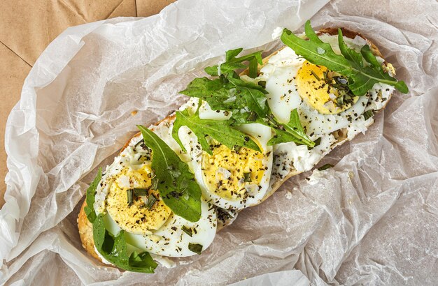 Toast with cream cheese arugula salad and boiled egg