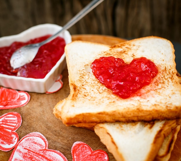 Toast with strawberry jam in a heart shape Valentine's Day