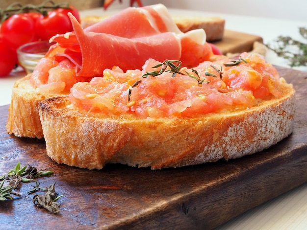 Toasted bread rubbed with fresh garlic and ripe tomato and ham jamon