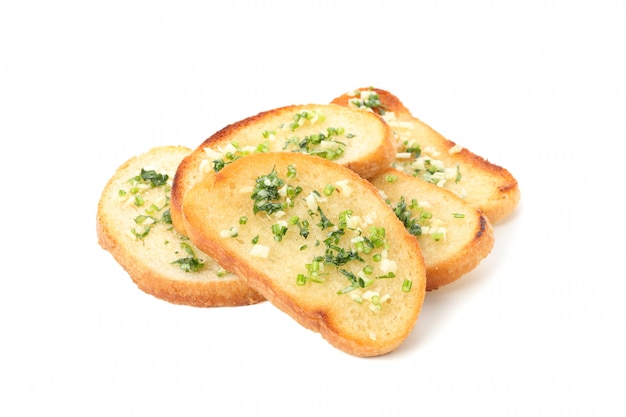 Toasted bread slices with garlic isolated on white