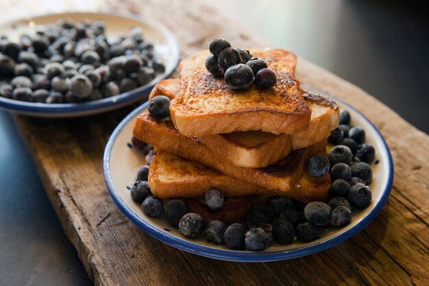 toasted bread with bluberries  french toast with berries sauce traditional sweet dessert