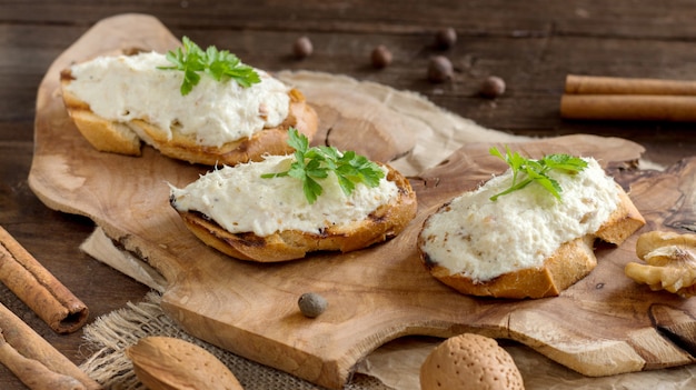 Toasted bread with a salted codfish mousse on wood close up