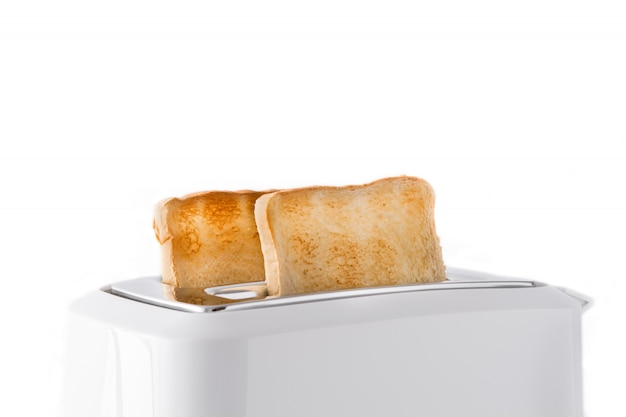 Toasted toast bread in white toaster isolated on white background