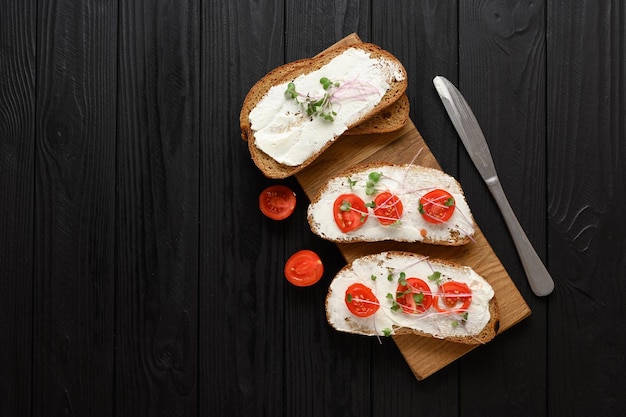 Toasts with microgreens on the table Healthy food vegan food and dieting concept