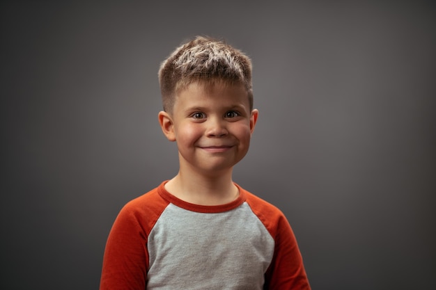 Toddler boy posing adorable cute portrait. Smiling little boy full of happy feelings