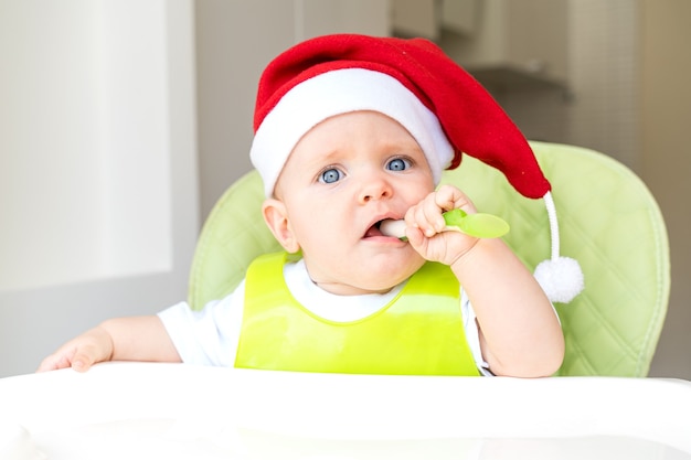 toddler sitting in a high chair and eats