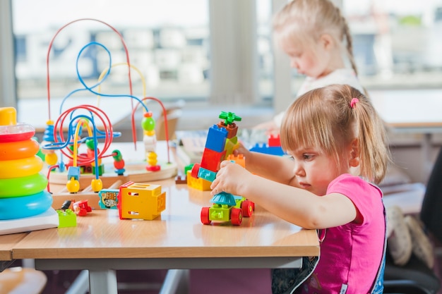 Toddlers playing in kindergarten