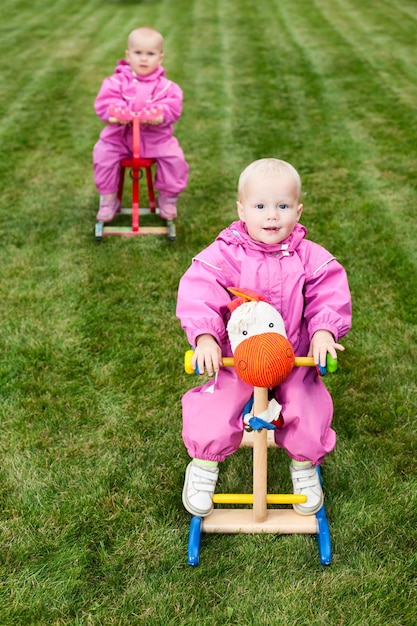 Toddlers on rocking horses