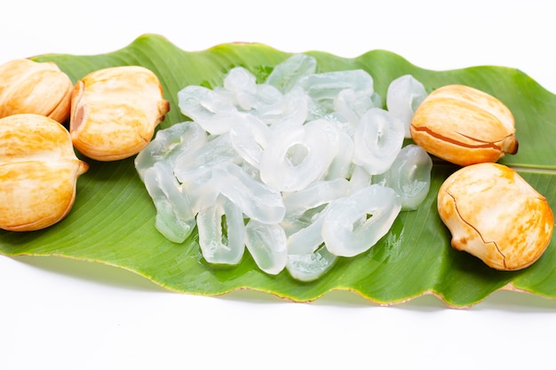 Toddy palm with slices on green leaf