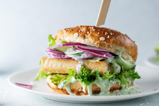 Tofu burger with vegetables on plate