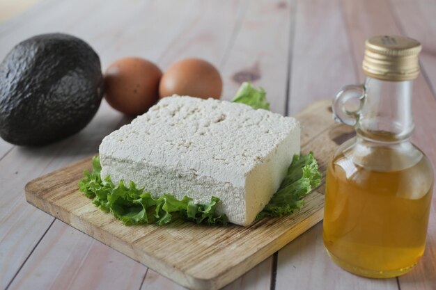 Tofu olive oil and avocado on table