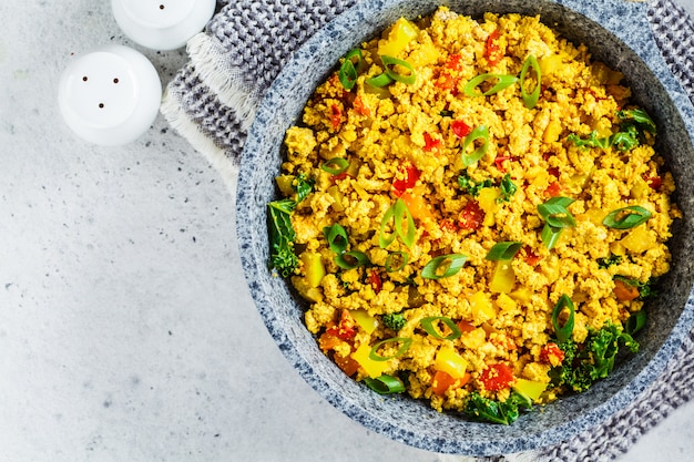 Tofu scramble with vegetables in a pan