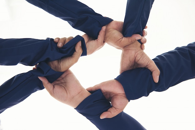 Together collaborate ring of hands teamwork isolated on white .