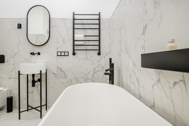 Toilet and detail of a corner shower cabin with wall mount shower attachment