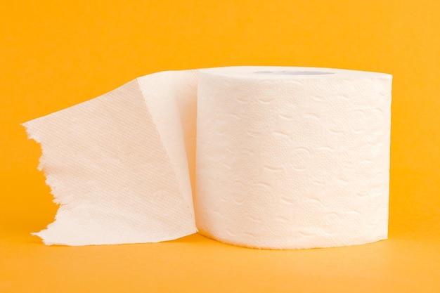 Toilet paper roll on a yellow background