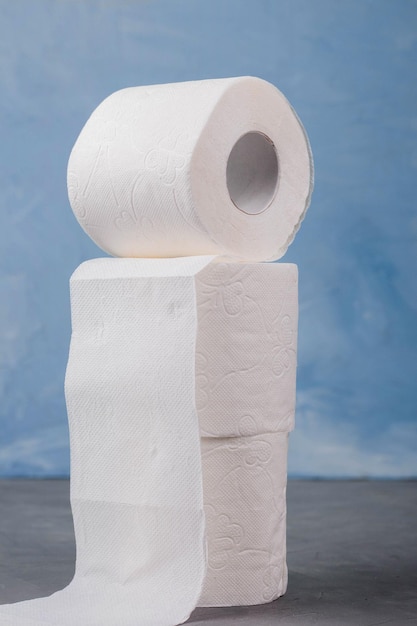 Toilet paper rolls on a blue background